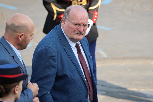 France’s junior Minister in charge of rural affairs Michel Fournier arrives for the annual Bastille Day military parade on the Champs-Elysees Avenue in Paris on July 14, 2026. (Photo by Ludovic MARIN / AFP)