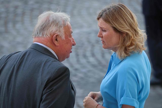 President of the French Senate Gerard Larcher and President of the French National Assembly Yael Braun-Pivet arrive for the annual Bastille Day military parade on the Champs-Elysees Avenue in Paris on July 14, 2026. (Photo by Ludovic MARIN / AFP)