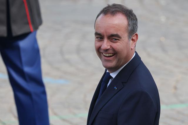 France's Prime Minister Sebastien Lecornu arrives for the annual Bastille Day military parade on the Champs-Elysees Avenue in Paris on July 14, 2026. (Photo by Ludovic MARIN / AFP)