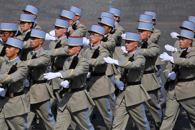Members of the National Active Non-Commissioned Officers School (ENSOA) parade during the annual Bastille Day military parade on the Champs-Elysees Avenue in Paris on July 14, 2026. (Photo by Ludovic MARIN / AFP)
