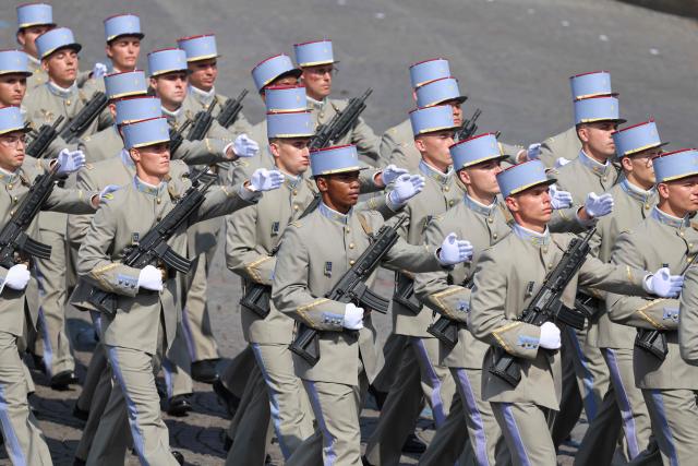 Members of the National Active Non-Commissioned Officers School (ENSOA) parade during the annual Bastille Day military parade on the Champs-Elysees Avenue in Paris on July 14, 2026. (Photo by Ludovic MARIN / AFP)
