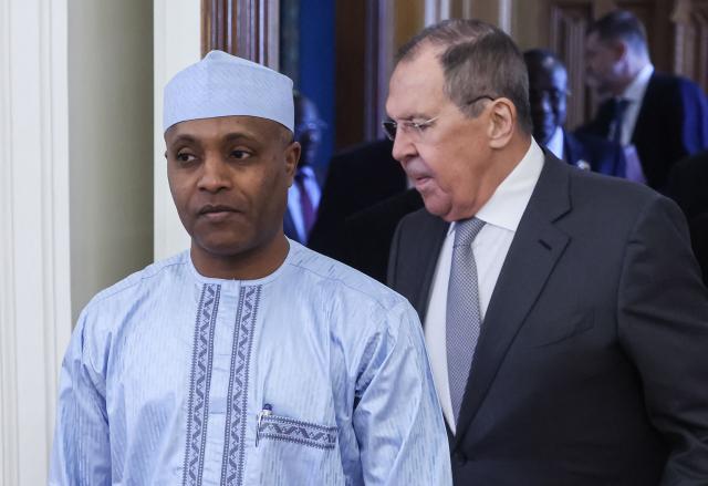 Russian Foreign Minister Sergei Lavrov and Chadian Foreign Minister Abdoulaye Sabre Fadoul enter a hall during a meeting in Moscow on July 14, 2026. (Photo by SERGEI ILNITSKY / POOL / AFP)