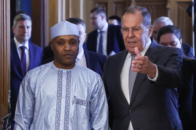 Russian Foreign Minister Sergei Lavrov and Chadian Foreign Minister Abdoulaye Sabre Fadoul enter a hall during a meeting in Moscow on July 14, 2026. (Photo by SERGEI ILNITSKY / POOL / AFP)