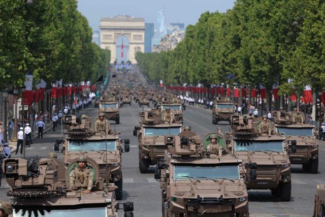 France's Armed Forces drive VBMR Griffon multirole armoured vehicles during the annual Bastille Day military parade on the Champs-Elysees Avenue in Paris on July 14, 2026. (Photo by Ludovic MARIN / AFP)