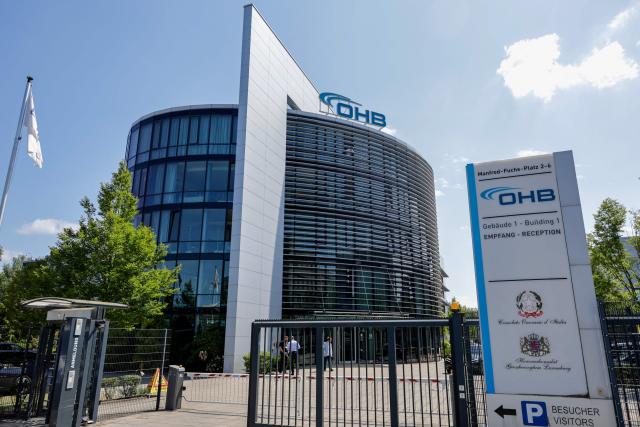 The entrance of German aerospace and technology company OHB is pictured at their headquarters in Bremen, northwestern Germany, on July 14, 2026. The German Defence Minister visited OHB during his summer tour throughout Germany. According to the group, it covers "the entire spectrum of modern space technologies", with activities ranging "from the development of complete satellite systems and space missions to infrastructure for access to space, as well as data-driven applications and digital services". (Photo by FOCKE STRANGMANN / AFP)