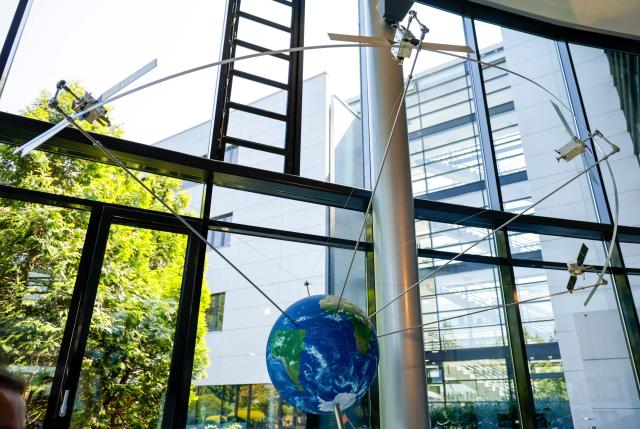 A model of a satellite is displayed in the entrance hall of German aerospace and technology company OHB is pictured at their headquarters in Bremen, northwestern Germany, on July 14, 2026. The German Defence Minister visited OHB during his summer tour throughout Germany. According to the group, it covers "the entire spectrum of modern space technologies", with activities ranging "from the development of complete satellite systems and space missions to infrastructure for access to space, as well as data-driven applications and digital services". (Photo by FOCKE STRANGMANN / AFP)