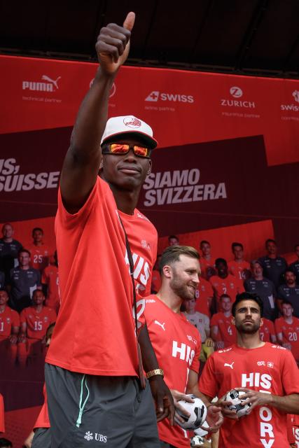 Switzerland's forward #07 Breel Embolo points towards supporters during a fan reception welcoming the team back to the country followingJohan Manzambi its 2026 FIFA World Cup quarter-final match against Argentina, in Zurich on July 14, 2026. (Photo by Fabrice COFFRINI / AFP)