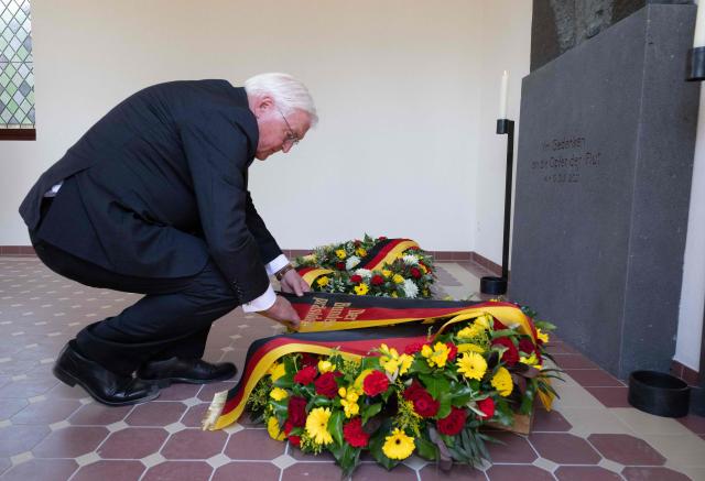 German President Frank-Walter Steinmeier lays a wreath on July 14, 2026 at the cemetery chapel in Ahrweiler, western Germany, to commemorate the victims of the dramatic floods from July 2021. More than 180 people lost their lives five years ago in severe floods that pummelled western Germany in mid-July 2021, raising questions about whether enough was done to forewarn residents. (Photo by Boris Roessler / POOL / AFP)