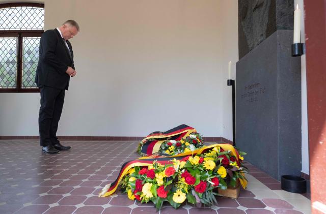 The State Premier of Rhineland-Palatinate Gordon Schnieder lays a wreath on July 14, 2026 at the cemetery chapel in Ahrweiler, western Germany, to commemorate the victims of the dramatic floods from July 2021. More than 180 people lost their lives five years ago in severe floods that pummelled western Germany in mid-July 2021, raising questions about whether enough was done to forewarn residents. (Photo by Boris Roessler / POOL / AFP)