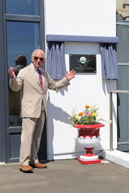 Britain's King Charles III unveils a plaque to commemorate the 150th anniversary of the Douglas Horse Tramway along the promenade in Douglas on the Isle of Man, an island in the Irish Sea off of the west coast England, on July 14, 2026. (Photo by Chris Jackson / POOL / AFP)