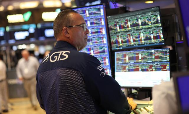 A trader works on the floor of the New York Stock Exchange (NYSE) in New York on July 14, 2026. (Photo by TIMOTHY A. CLARY / AFP)