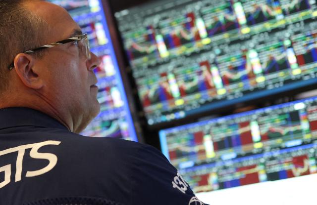 A trader works on the floor of the New York Stock Exchange (NYSE) in New York on July 14, 2026. (Photo by TIMOTHY A. CLARY / AFP)