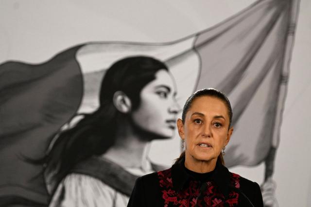 Mexico's President Claudia Sheinbaum speaks during her daily press conference at Palacio Nacional in Mexico City on July 14, 2026. Homicides in Mexico have fallen by nearly half since September 2024, President Claudia Sheinbaum said, touting the reduction as a result of her security policies since taking office in October 2024. (Photo by Alfredo ESTRELLA / AFP)