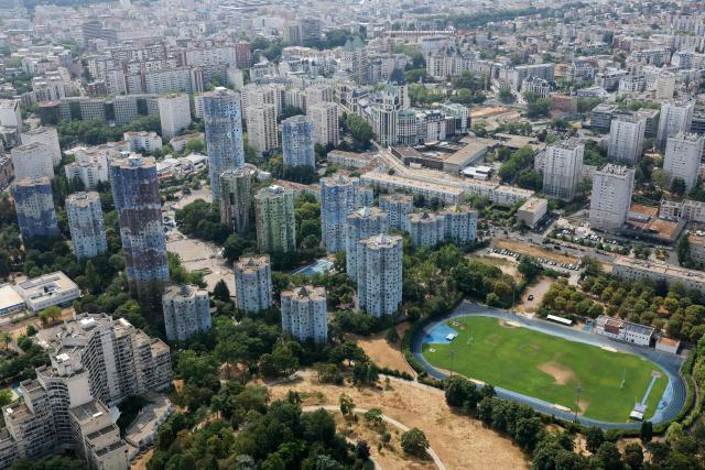 This aerial photograph taken on July 14, 2026, shows the Aillaud towers and the Pablo-Picasso district in Nanterre, western surbubs of Paris. (Photo by Thomas SAMSON / AFP)