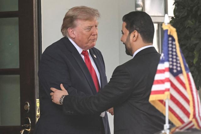 US President Donald Trump shakes hands with Prime Minister of Iraq Ali al-Zaidi (R) outside the West wing of the White House in Washington, DC, on July 14, 2026. (Photo by SAUL LOEB / AFP)