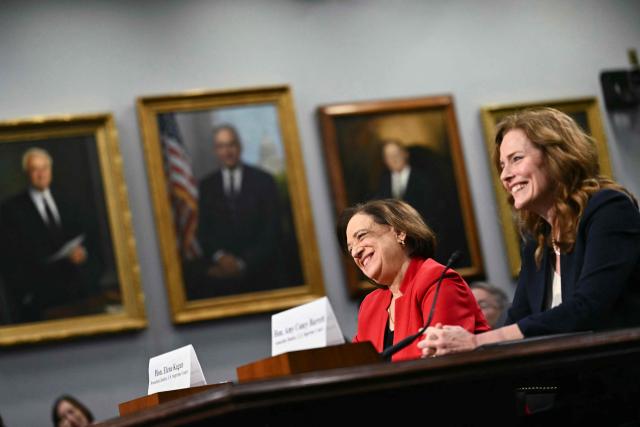 (From L-R) US Supreme Court Justice Elena Kagan and US Supreme Court Justice Amy Coney Barrett testify during a House Appropriations Subcommittee on Financial Services hearing on Capitol Hill in Washington, DC, on July 14, 2026. Two US Supreme Court justices made a rare appearance before Congress on Tuesday, seeking funding to protect judges and their families after a divisive term that deepened tensions between the court and President Donald Trump. (Photo by Kent NISHIMURA / AFP)