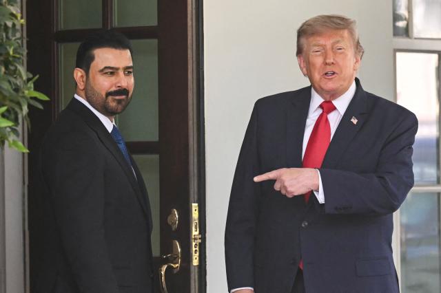 US President Donald Trump greets Prime Minister of Iraq Ali al-Zaidi (L) outside the West wing of the White House in Washington, DC, on July 14, 2026. (Photo by SAUL LOEB / AFP)