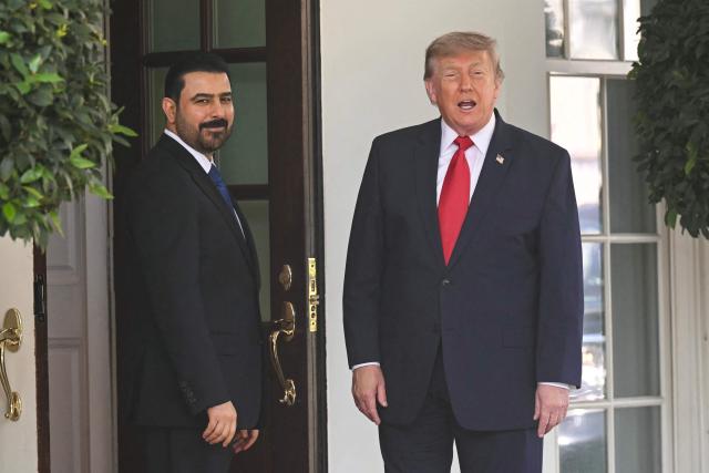 US President Donald Trump greets Prime Minister of Iraq Ali al-Zaidi (L) outside the West wing of the White House in Washington, DC, on July 14, 2026. (Photo by SAUL LOEB / AFP)