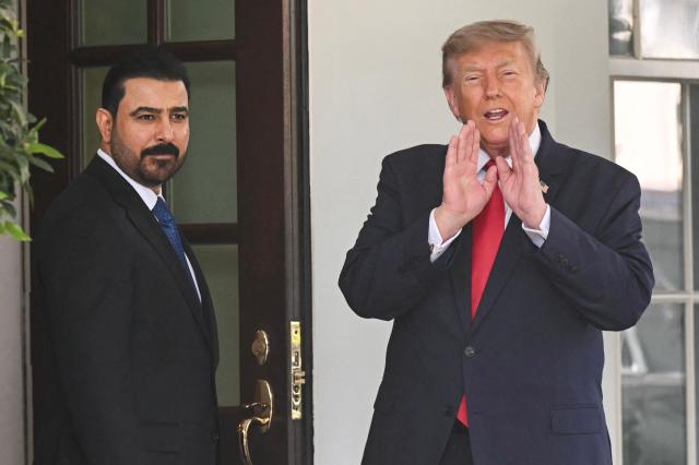 US President Donald Trump greets Prime Minister of Iraq Ali al-Zaidi (L) outside the West wing of the White House in Washington, DC, on July 14, 2026. (Photo by SAUL LOEB / AFP)