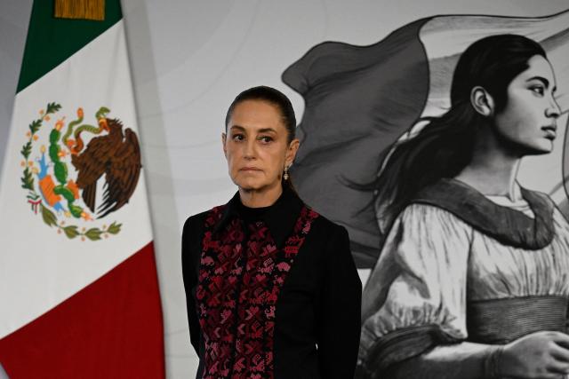 Mexico's President Claudia Sheinbaum looks on during her daily press conference at the National Palace in Mexico City on July 14, 2026. Homicides in Mexico have fallen by nearly half since September 2024, President Claudia Sheinbaum said, touting the reduction as a result of her security policies since taking office in October 2024. (Photo by Alfredo ESTRELLA / AFP)