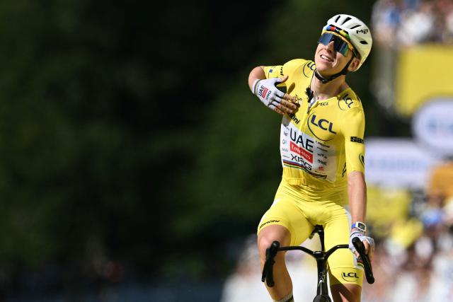UAE Team Emirates - XRG's Slovenian rider Tadej Pogacar cycles to the finish line to win the 10th stage of the 113th edition of the Tour de France cycling race, 166,6 km between Aurillac and Le Lioran in the Massif Central, on July 14, 2026. (Photo by Jeff PACHOUD / AFP)