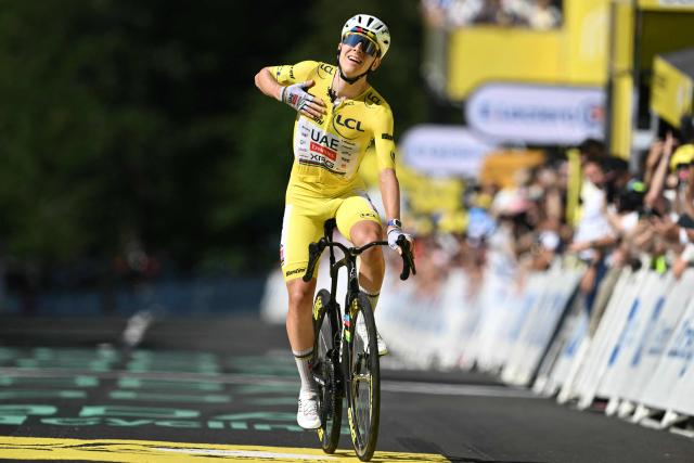 UAE Team Emirates - XRG's Slovenian rider Tadej Pogacar cycles to the finish line to win the 10th stage of the 113th edition of the Tour de France cycling race, 166,6 km between Aurillac and Le Lioran in the Massif Central, on July 14, 2026. (Photo by Jeff PACHOUD / AFP)