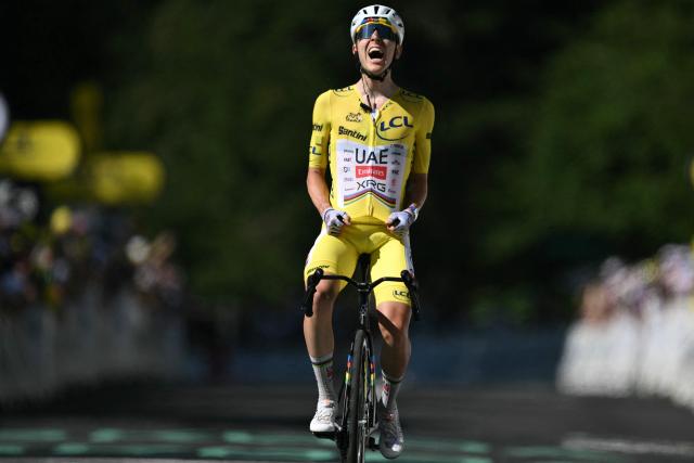 UAE Team Emirates - XRG's Slovenian rider Tadej Pogacar cycles to the finish line to win the 10th stage of the 113th edition of the Tour de France cycling race, 166,6 km between Aurillac and Le Lioran in the Massif Central, on July 14, 2026. (Photo by Jeff PACHOUD / AFP)