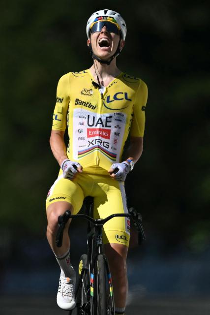 UAE Team Emirates - XRG's Slovenian rider Tadej Pogacar cycles to the finish line to win the 10th stage of the 113th edition of the Tour de France cycling race, 166,6 km between Aurillac and Le Lioran in the Massif Central, on July 14, 2026. (Photo by Jeff PACHOUD / AFP)