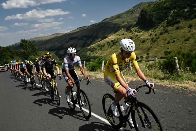 UAE Team Emirates - XRG's Slovenian rider Tadej Pogacar wearing the overall leader's yellow jersey cycles during the 10th stage of the 113th edition of the Tour de France cycling race, 166,6 km between Aurillac and Le Lioran in the Massif Central, on July 14, 2026. (Photo by Loic VENANCE / AFP)