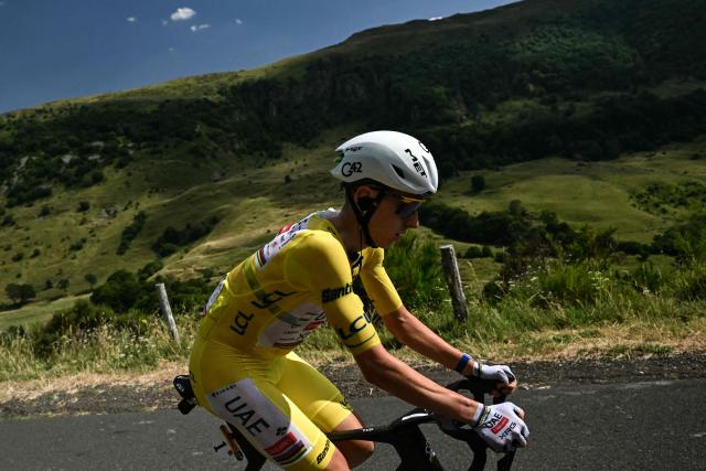 UAE Team Emirates - XRG's Slovenian rider Tadej Pogacar wearing the overall leader's yellow jersey cycles during the 10th stage of the 113th edition of the Tour de France cycling race, 166,6 km between Aurillac and Le Lioran in the Massif Central, on July 14, 2026. (Photo by Loic VENANCE / AFP)