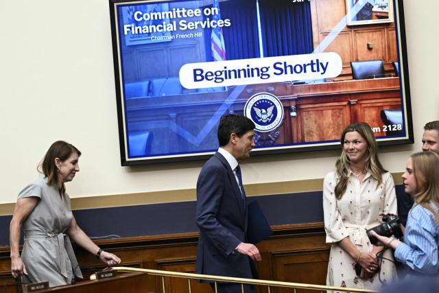 US Federal Reserve Chair Kevin Warsh (C) arrives to testify during a House Financial Services Committee hearing titled "The Federal Reserve's Semi-Annual Monetary Policy Report" on Capitol Hill in Washington, DC, on July 14, 2026. (Photo by Brendan SMIALOWSKI / AFP)