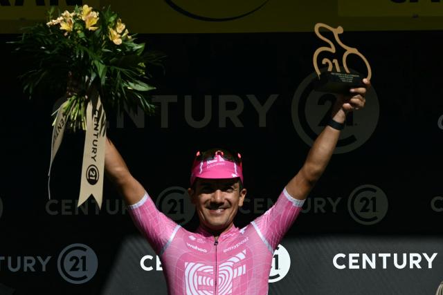 EF Education - EasyPost team's Ecuadorian rider Richard Carapaz celebrates on the podium with the most combative rider's award after the 10th stage of the 113th edition of the Tour de France cycling race, 166,6 km between Aurillac and Le Lioran in the Massif Central, on July 14, 2026. (Photo by Jeff PACHOUD / AFP)