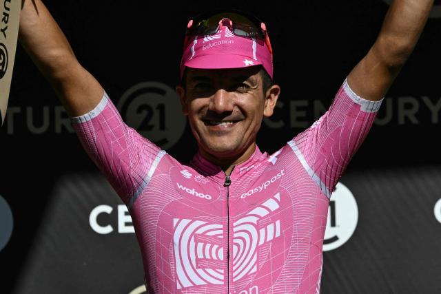EF Education - EasyPost team's Ecuadorian rider Richard Carapaz celebrates on the podium with the most combative rider's award after the 10th stage of the 113th edition of the Tour de France cycling race, 166,6 km between Aurillac and Le Lioran in the Massif Central, on July 14, 2026. (Photo by Jeff PACHOUD / AFP)