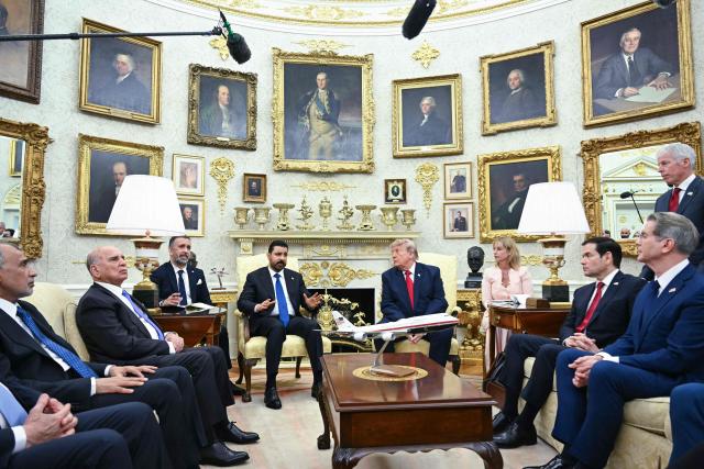 US President Donald Trump takes questions from reporters during a meeting with Prime Minister of Iraq Ali al-Zaidi in the Oval Office of the White House in Washington, DC, on July 14, 2026. (Photo by SAUL LOEB / AFP)