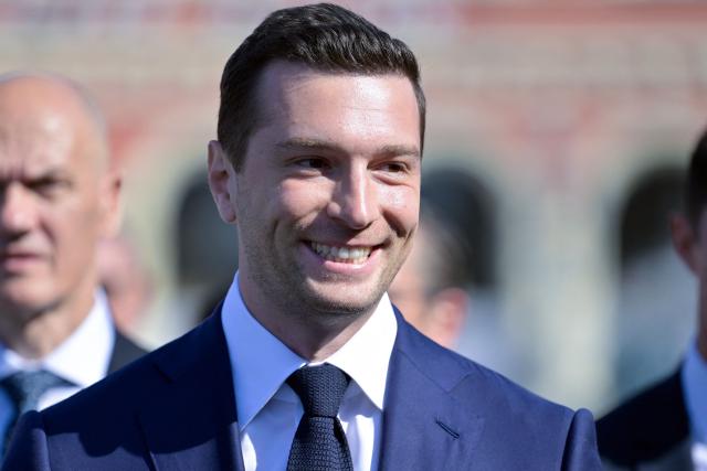 President of French far-right party Rassemblement National (RN) Jordan Bardella arrives to attend a ceremony marking the 10th anniversary of an attack that killed 86 people and injured more than 400 in Nice, on the French riviera city of Nice on July 14, 2026. A solemn march, an interfaith ceremony, a military parade and a memorial service presided over by French President are on the programme for the commemorations marking the 10th anniversary of the attack on the Promenade des Anglais in Nice, as announced by the city council on July 1, 2026. On July 14, 2016, Mohamed Lahouaiej-Bouhlel, a Tunisian national, drove a 19-tonne lorry for nearly 2 km into the crowd that had just been watching the fireworks, killing 86 people and injuring more than 400 before he was shot dead. (Photo by Philippe Magoni / POOL / AFP)