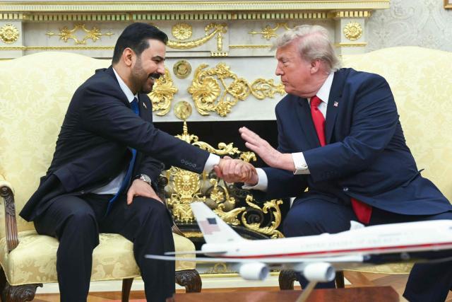 US President Donald Trump shakes hands with Prime Minister of Iraq Ali al-Zaidi (L) in the Oval Office of the White House in Washington, DC, on July 14, 2026. (Photo by SAUL LOEB / AFP)