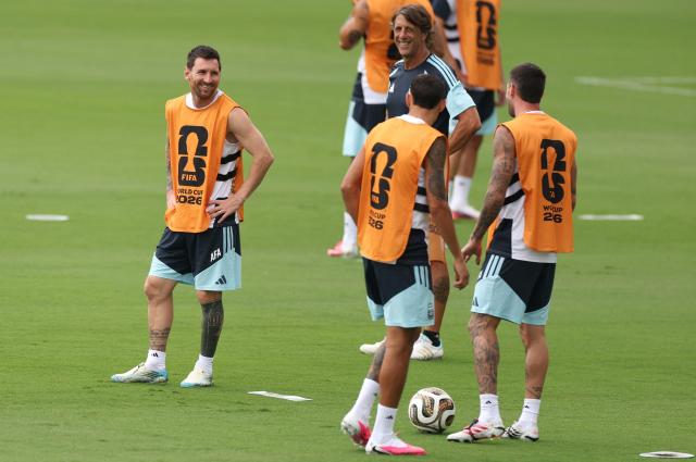 Argentina's forward #10 Lionel Messi smiles with teammates during a training session on the eve of the 2026 World Cup football tournament semi-final match between England and Argentina, at Atlanta United Training Centre in Atlanta on July 14, 2026.  (Photo by PATRICIA DE MELO MOREIRA / AFP)