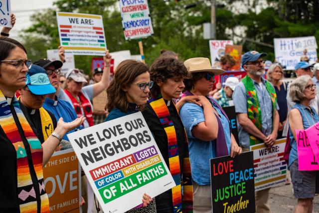 Demonstrators hold a protest outside of the Immigration and Customs Enforcement (ICE) field office in Scarborough, Maine, on July 14, 2026. A US immigration officer on July 13, fatally shot a man identified by rights groups as a 26-year-old Colombian, an incident likely to fuel criticism of President Donald Trump's deportation drive. The shooting happened in Biddeford, a town of 22,000 people in the northern state of Maine, and comes a week after an Immigration and Customs Enforcement (ICE) agent shot dead a Mexican man in Texas. (Photo by JOSEPH PREZIOSO / AFP)