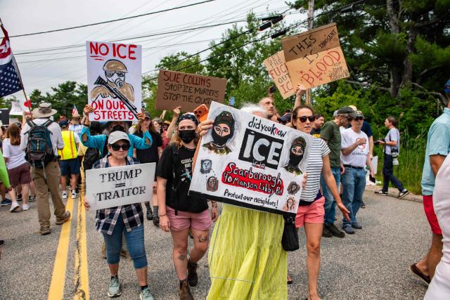 Demonstrators hold a protest outside of the Immigration and Customs Enforcement (ICE) field office in Scarborough, Maine, on July 14, 2026. A US immigration officer on July 13, fatally shot a man identified by rights groups as a 26-year-old Colombian, an incident likely to fuel criticism of President Donald Trump's deportation drive. The shooting happened in Biddeford, a town of 22,000 people in the northern state of Maine, and comes a week after an Immigration and Customs Enforcement (ICE) agent shot dead a Mexican man in Texas. (Photo by JOSEPH PREZIOSO / AFP)