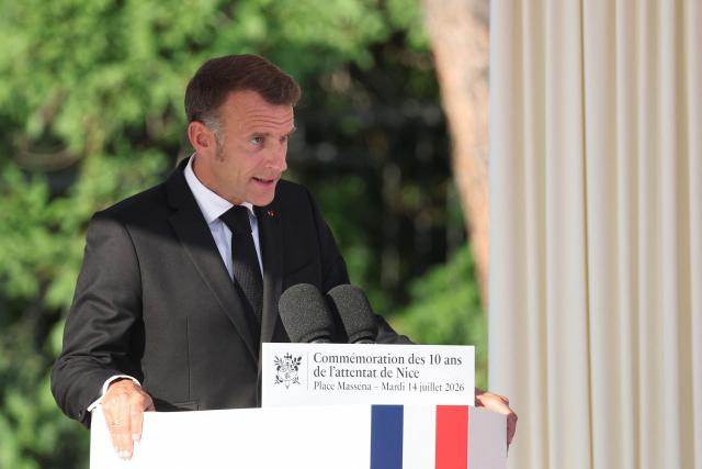 France's President Emmanuel Macron delivers a speech during a ceremony marking the 10th anniversary of an attack that killed 86 people and injured more than 400 in Nice, on the French riviera city of Nice on July 14, 2026. A solemn march, an interfaith ceremony, a military parade and a memorial service presided over by French President are on the programme for the commemorations marking the 10th anniversary of the attack on the Promenade des Anglais in Nice, as announced by the city council on July 1, 2026.
On July 14, 2016, Mohamed Lahouaiej-Bouhlel, a Tunisian national, drove a 19-tonne lorry for nearly 2 km into the crowd that had just been watching the fireworks, killing 86 people and injuring more than 400 before he was shot dead. (Photo by Valery HACHE / AFP)