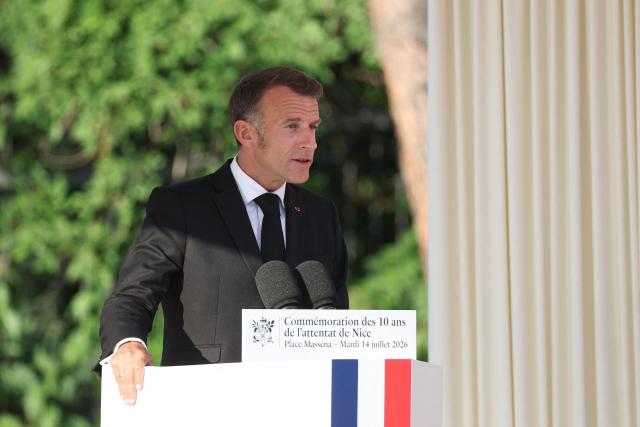 France's President Emmanuel Macron delivers a speech during a ceremony marking the 10th anniversary of an attack that killed 86 people and injured more than 400 in Nice, on the French riviera city of Nice on July 14, 2026. A solemn march, an interfaith ceremony, a military parade and a memorial service presided over by French President are on the programme for the commemorations marking the 10th anniversary of the attack on the Promenade des Anglais in Nice, as announced by the city council on July 1, 2026.
On July 14, 2016, Mohamed Lahouaiej-Bouhlel, a Tunisian national, drove a 19-tonne lorry for nearly 2 km into the crowd that had just been watching the fireworks, killing 86 people and injuring more than 400 before he was shot dead. (Photo by Valery HACHE / AFP)