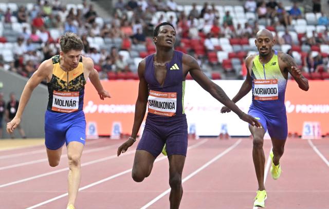 (L-R) Hungary's Attila Molnar, Zambia's Muzala Samukonga and US' Vernon Norwood compete during the men's 400m competition of the Gyulai Istvan Memorial Athletics Grand Prix in Budapest, Hungary on July 14, 2026. (Photo by Attila KISBENEDEK / AFP)