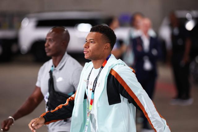 France's forward #10 Kylian Mbappe arrives for the 2026 World Cup football tournament semi-final match between France and Spain at the Dallas Stadium in Arlington on July 14, 2026.  (Photo by FRANCK FIFE / AFP)