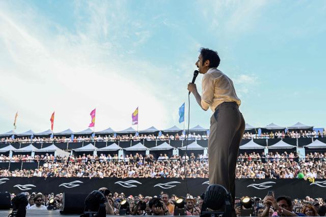 French rock band Feu! Chatterton's singer Arthur Teboul performs on stage during the 42nd Francofolies music festival, in La Rochelle, western France, on July 14, 2026. Created in 1985, the festival is dedicated to French-language and francophone music and runs until July 14, 2026. (Photo by Philippe LOPEZ / AFP)