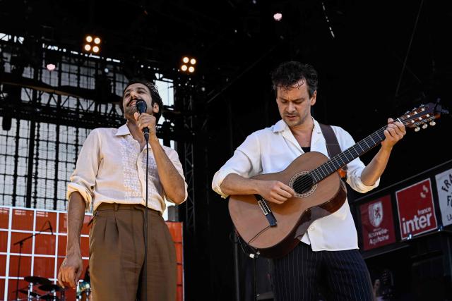 French rock band Feu! Chatterton's singer Arthur Teboul (L) and guitarist Sebastien Wolf (R) perform on stage during the 42nd Francofolies music festival, in La Rochelle, western France, on July 14, 2026. Created in 1985, the festival is dedicated to French-language and francophone music and runs until July 14, 2026. (Photo by Philippe LOPEZ / AFP)