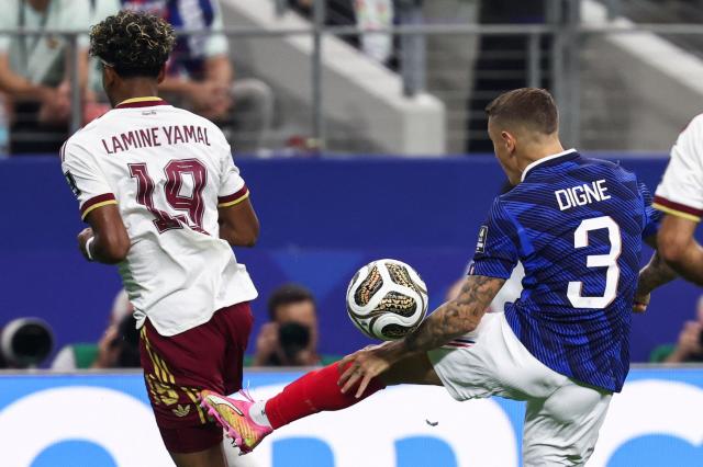 Spain's forward #19 Lamine Yamal is fouled by France's defender #03 Lucas Digne for a penalty kick during the 2026 World Cup football tournament semi-final match between France and Spain at the Dallas Stadium in Arlington on July 14, 2026.  (Photo by FRANCK FIFE / AFP)