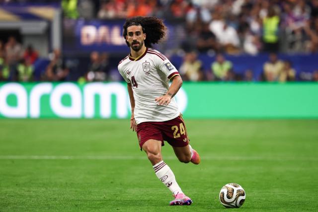 Spain's defender #24 Marc Cucurella runs with the ball during the 2026 World Cup football tournament semi-final match between France and Spain at the Dallas Stadium in Arlington on July 14, 2026.  (Photo by FRANCK FIFE / AFP)