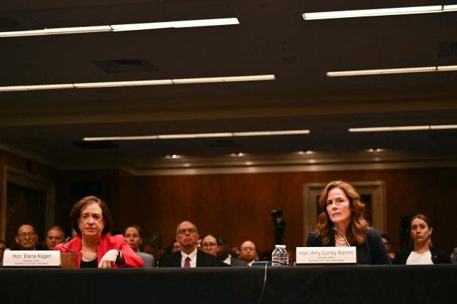 US Supreme Court Justices Amy Coney Barrett (R) and Elena Kagan testify during a Senate Appropriations Subcommittee on Financial Services hearing on Capitol Hill in Washington, DC, on July 14, 2026. (Photo by Kent NISHIMURA / AFP)