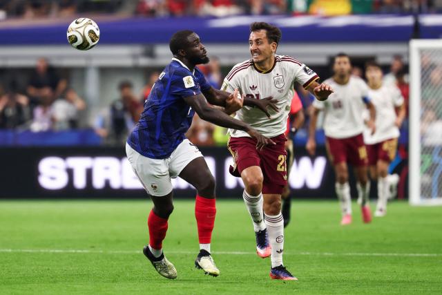 Spain's forward #21 Mikel Oyarzabal (R) and France's defender #04 Dayot Upamecano fight for the ball during the 2026 World Cup football tournament semi-final match between France and Spain at the Dallas Stadium in Arlington on July 14, 2026.  (Photo by FRANCK FIFE / AFP)