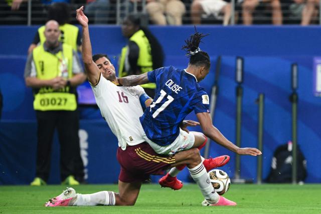 Spain's midfielder #16 Rodri (L) and France's forward #11 Michael Olise (R) fight for the ball during the 2026 World Cup football tournament semi-final match between France and Spain at the Dallas Stadium in Arlington on July 14, 2026.  (Photo by RONALDO SCHEMIDT / AFP)